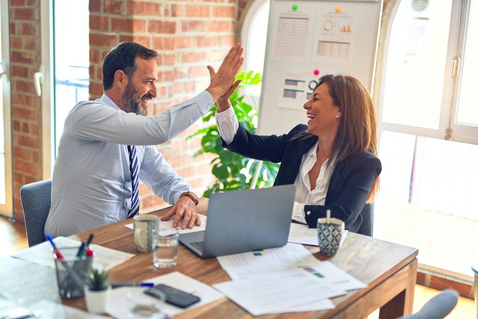 Professionals reviewing work together